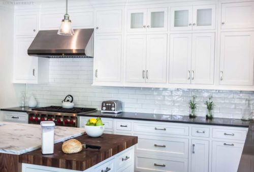 White cabinets, counter, range and stained kitchen island Madison, NJ