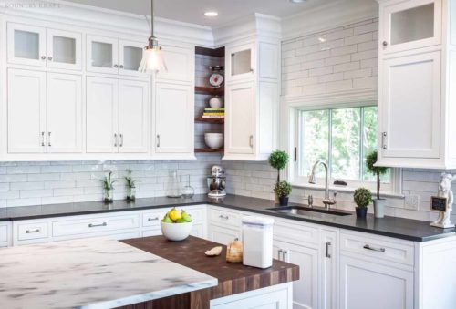 Stained kitchen island, white cabinets, counter, and sink Madison, NJ