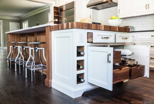 Stained kitchen island with built in cabinet, drawers, and wine cubbies, Madison, NJ