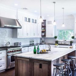 White cabinets, counter, fridge, range, and stained kitchen island Madison, NJ