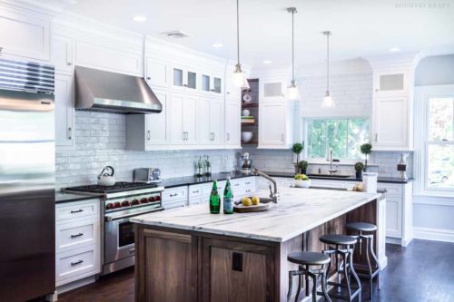 White cabinets, counter, fridge, range, and stained kitchen island Madison, NJ