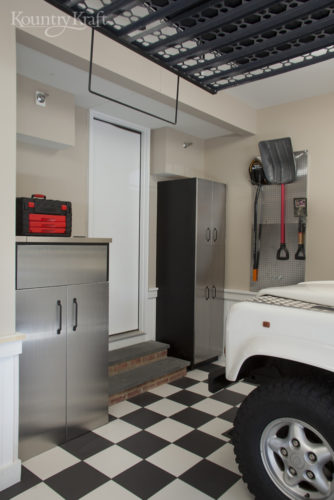 Custom Garage Storage Cabinets with checkerboard floor in Bethesda, MD