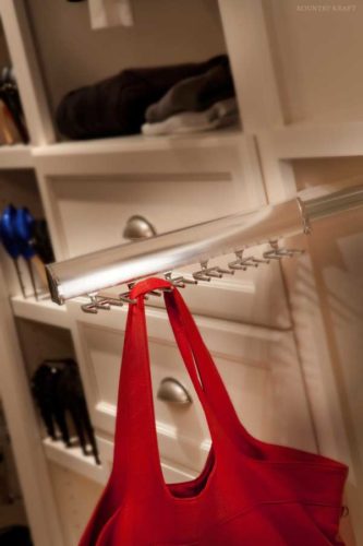 Closet rack with horizontal sliding hooks with red bag Bethesda, MD
