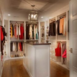 Zoomed out view of master closet filled with clothing, shoes, belts, and bags Bethesda, MD