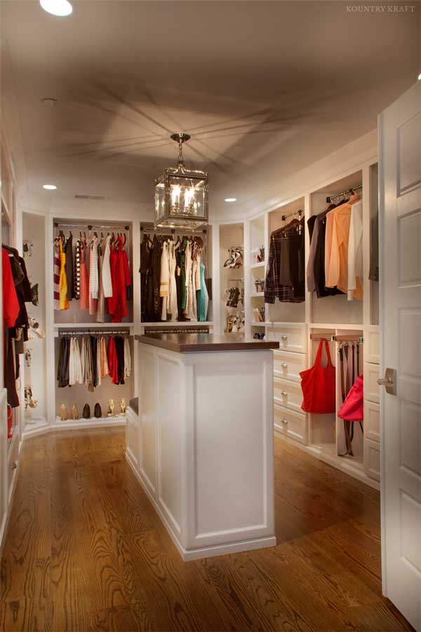 Zoomed out view of master closet filled with clothing, shoes, belts, and bags Bethesda, MD