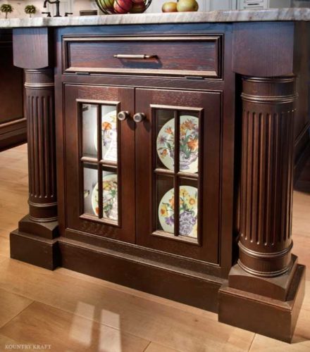 Kitchen island with storage cabinet featuring glass paned doors Ellicott City, MD