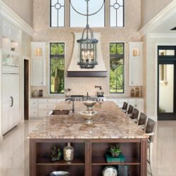 Tall kitchen featuring an island with built-in shelves Naples, FL