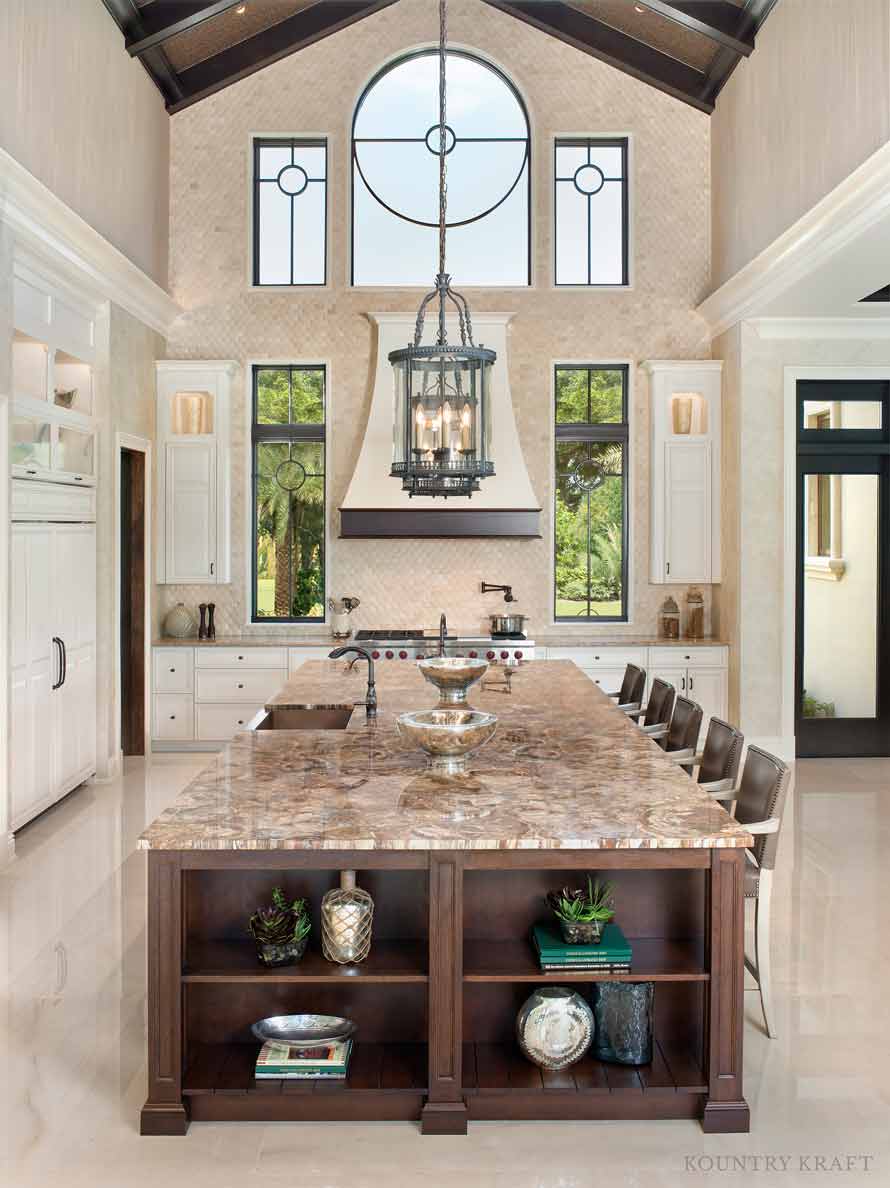 Tall kitchen featuring an island with built-in shelves Naples, FL