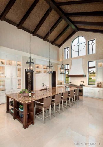 Tall kitchen featuring an island with four chairs Naples, FL