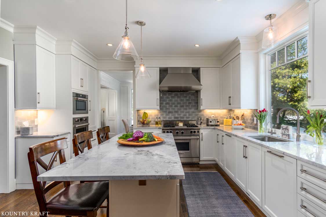White Transitional Farmhouse Kitchen Cabinets with Silver Cabinet Hardware in West Newbury, Massachusetts