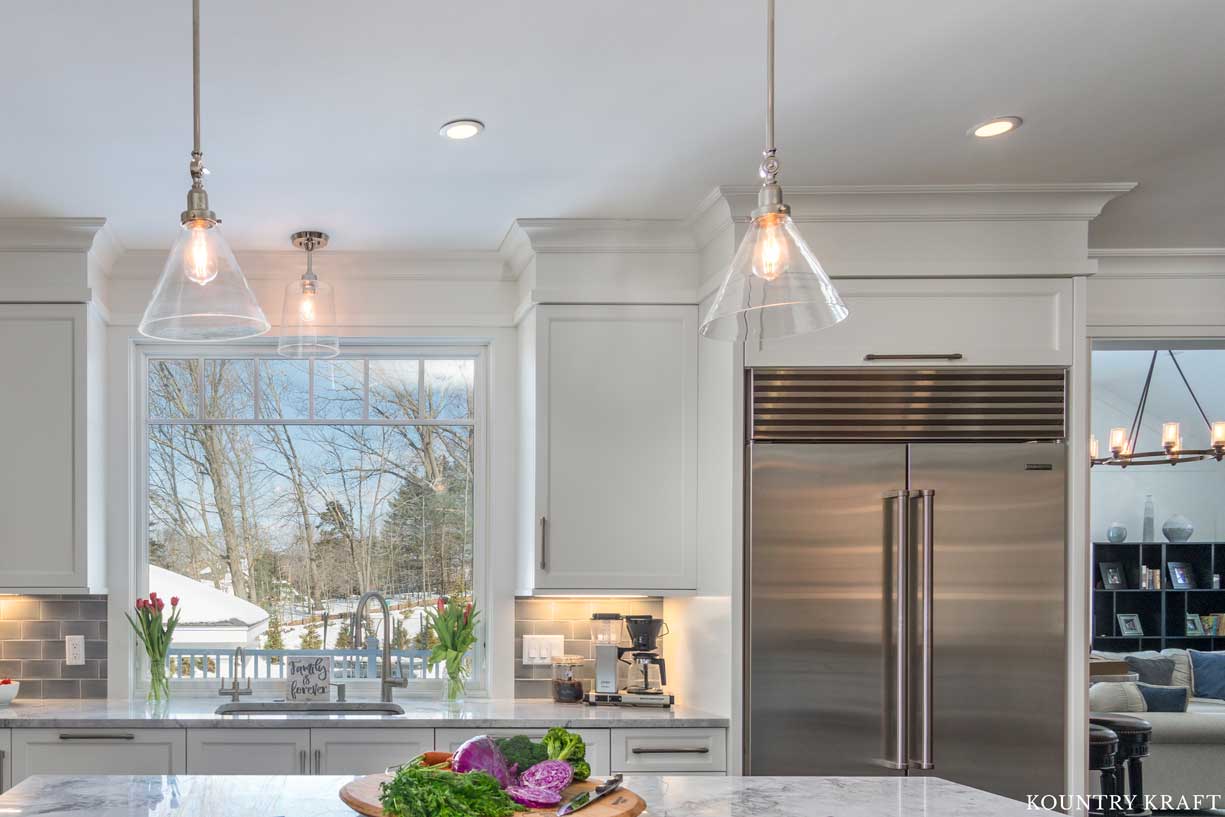 White Transitional Farmhouse Kitchen Cabinets with Custom Crown Molding and Window Trim 