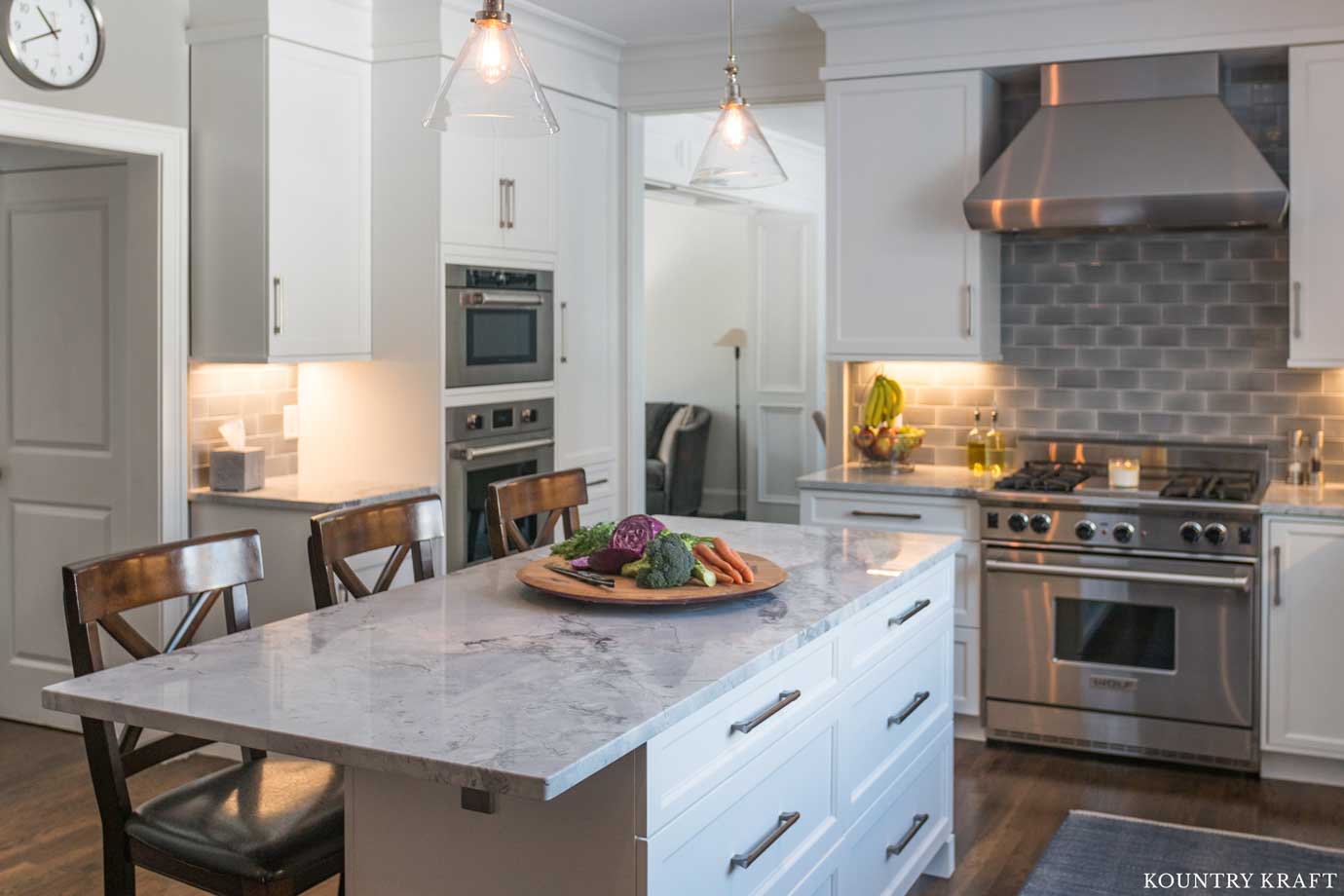 Transitional Farmhouse Kitchen with a Large White Island with Bar Seating