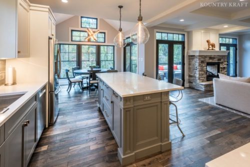 Gauntlet gray painted island with built-in outlet in a traditional kitchen in Sinking Spring, Pennsylvania