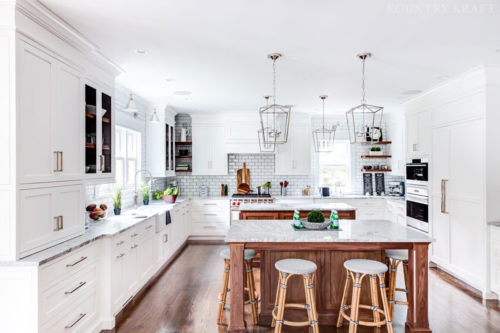 Two kitchen islands with natural marble Carrara countertops for a kitchen located in Madison, New Jersey