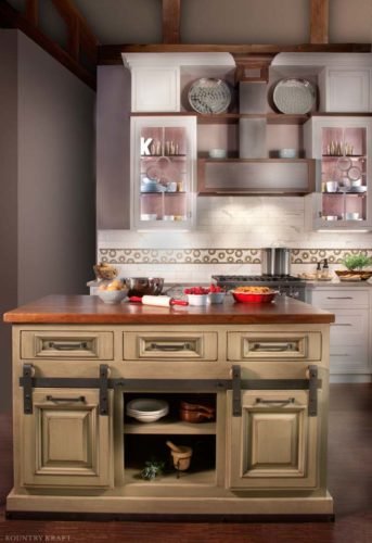 A Kitchen Island Featuring Adjustable Shelves and Sliding Cabinet Doors for Easy Accessibility
