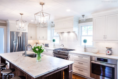 Kitchen including a oven, range, fridge, and walnut island with sink Madison, NJ