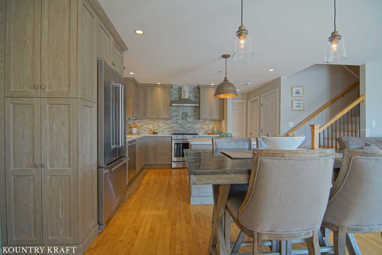 Transitional Kitchen Designed with Weathered Grain Cabinets for a Home in Hampton, New Hampshire