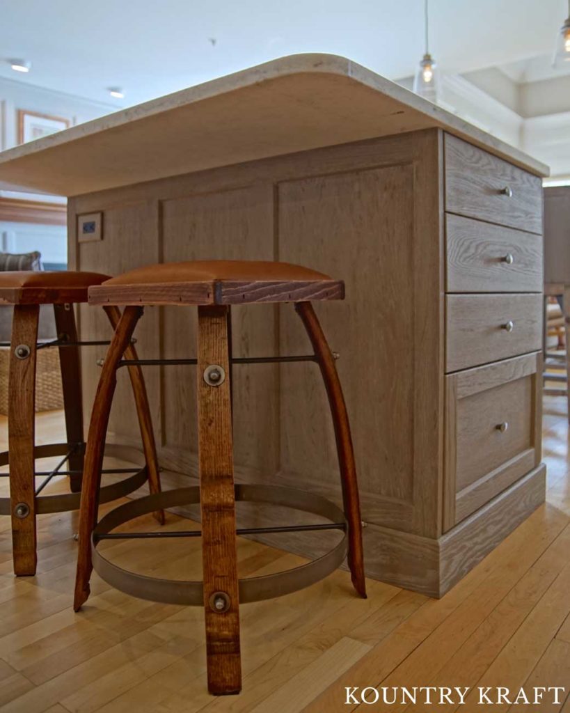 This Kitchen Island Allows for More Seating and Storage with Weathered Grain Cabinets and Drawers