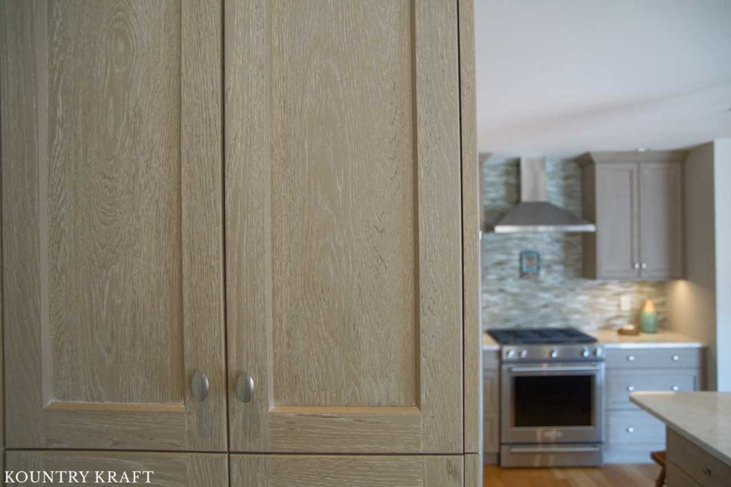 Close Up of a Weathered Grain Cabinet in this Transitional Kitchen Located in New Hampshire