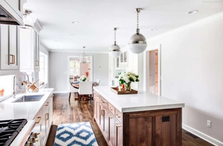 Kitchen counter, walnut kitchen island, and white cabinets in Summit, NJ