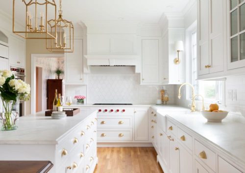 White kitchen cabinet brass hardware to add color to any kitchen