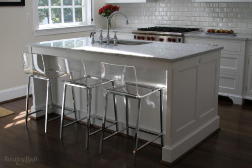 White kitchen cabinets in Bethesda, Maryland with acrylic counter height stools