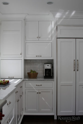 White kitchen cabinetry in Bethesda, Maryland with appliance garage