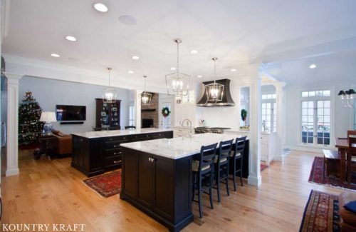 Two Parallel Kitchen Islands Featuring White and Black Kitchen Cabinets in Reisterstown, Maryland 