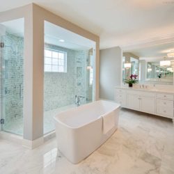 White bathroom with tub, shower, and vanity Devon, PA