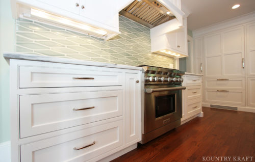 Classic white cabinets and 36" Wolf range with under cabinet lighting Madison, NJ