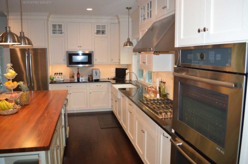 Ovens, microwave, stove, and white cabinets Wyomissing, PA