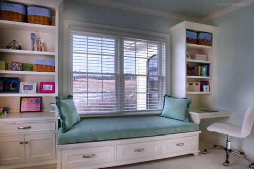 Window seat, white cabinets, and mini desk with chair Ellicott City, Maryland