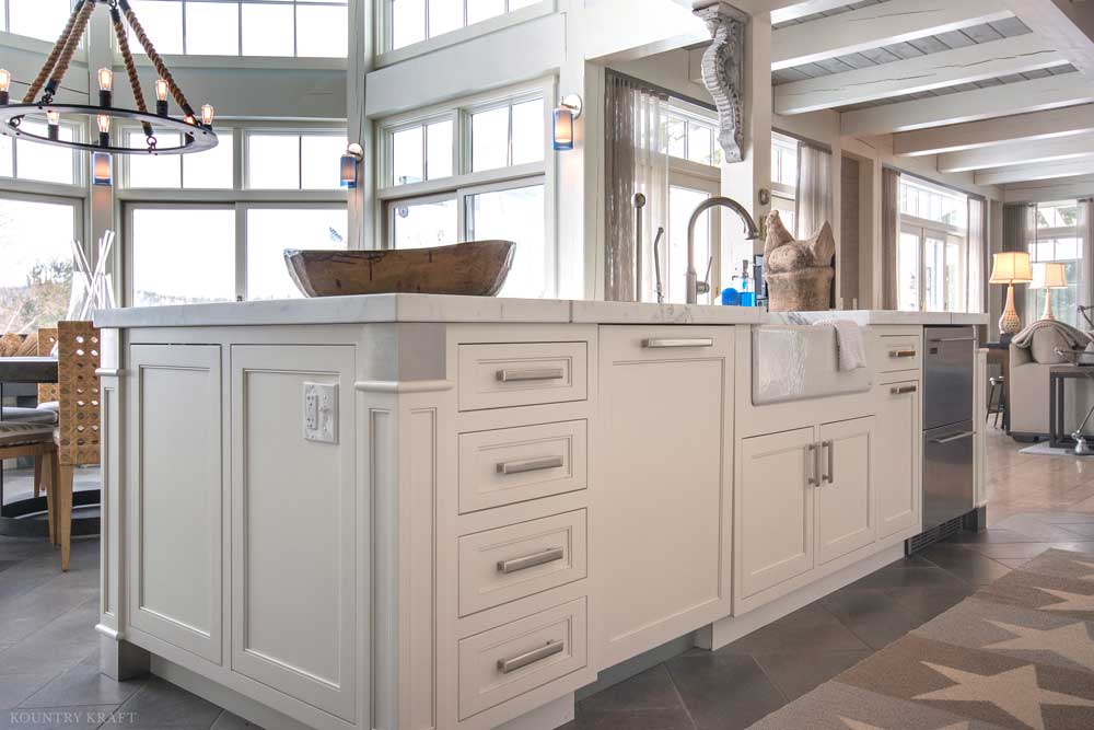 White cabinet kitchen island with built in outlet, sink, and dishwasher Lake Winnipesauke, NH