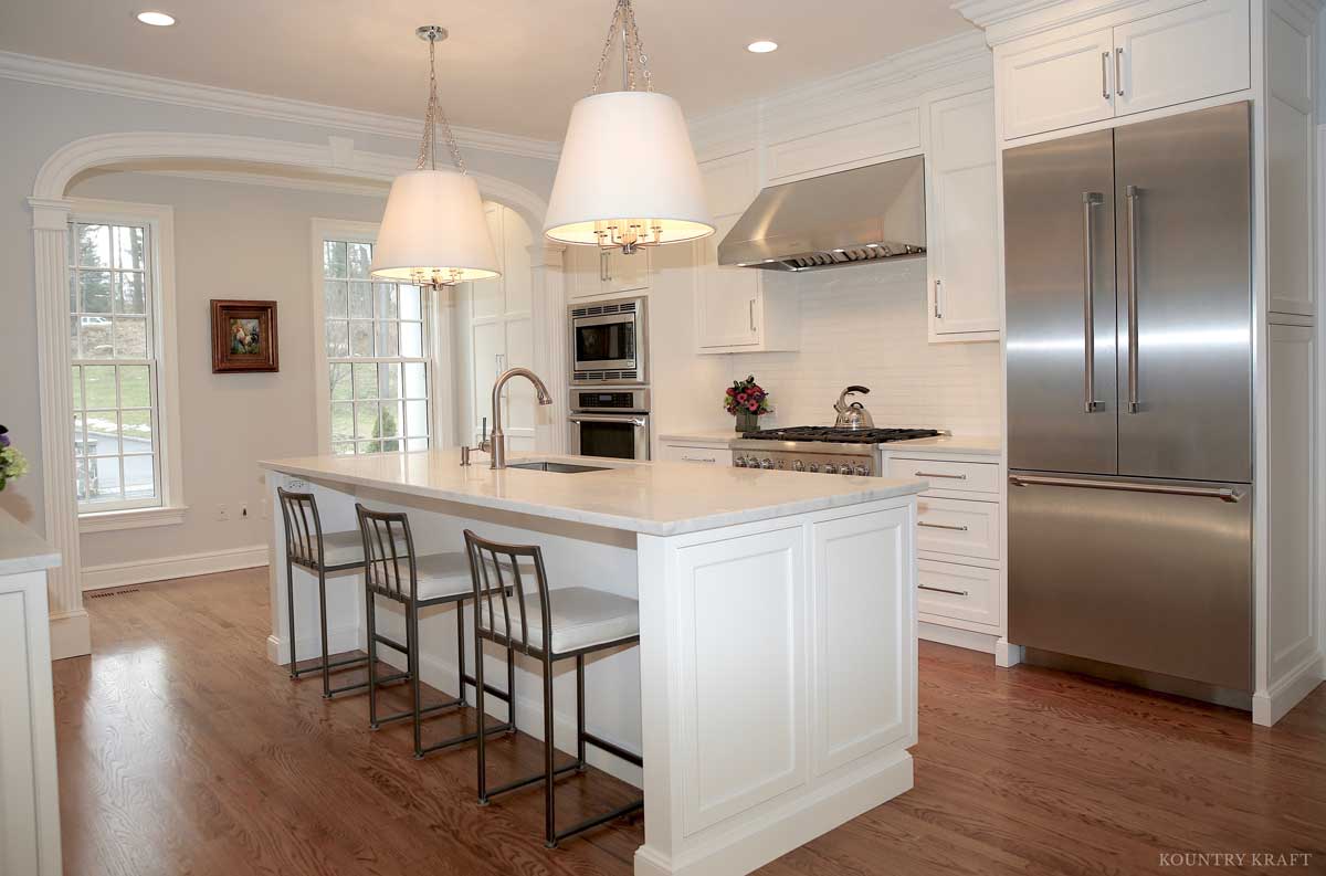 White custom cabinetry and stainless steel refrigerator New Canaan, CT