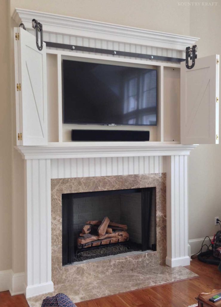 White dove fireplace mantel surround with open TV cabinet Malvern, PA