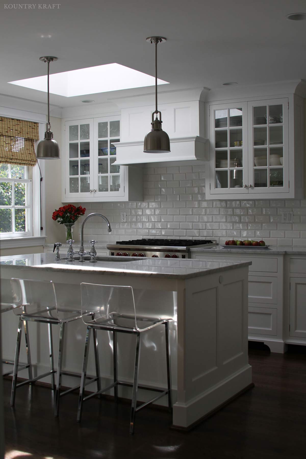 White kitchen cabinets and island with clear seats Bethesda, MD