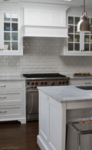White kitchen cabinets, range, and island Bethesda, MD