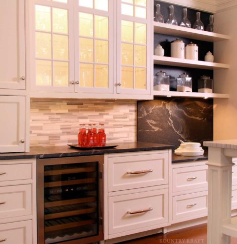 White kitchen cabinets, wine cooler, shelves, and black countertops New Canaan, CT