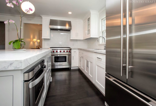 Refrigerator, range, and white L shaped kitchen cabinets Summit, NJ