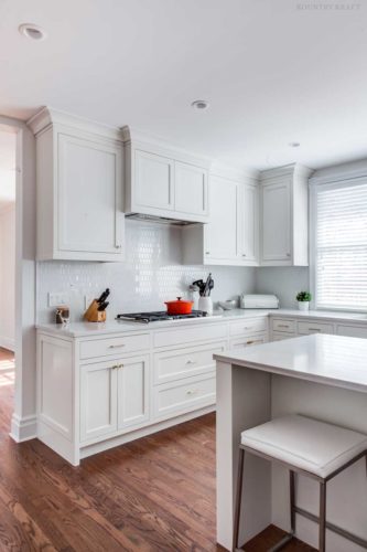 White kitchen with cabinets, counters, and range Short Hills, NJ