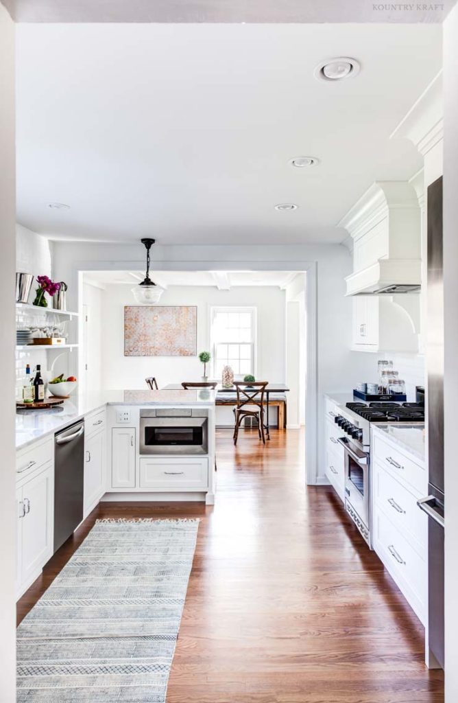 White kitchen with hardwood floor and white cabinetry Upper Montclair, NJ