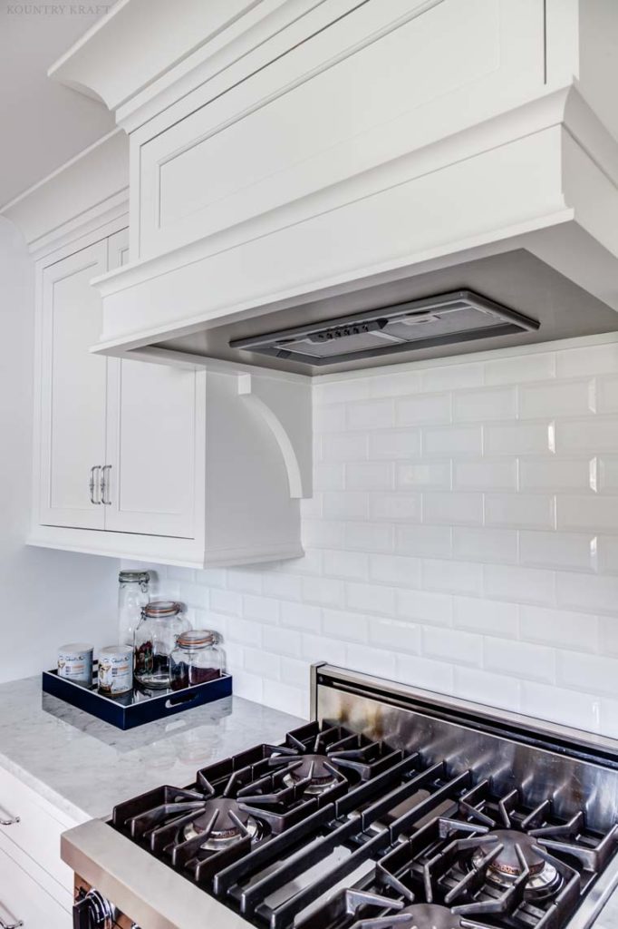 White cabinetry and range in a white kitchen Upper Montclair, NJ
