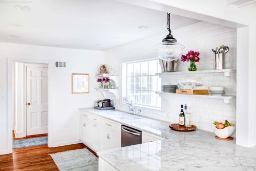 White kitchen featuring dishwasher, window, and counter Upper Montclair, NJ