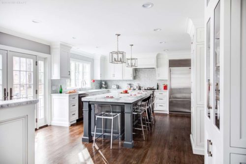 White kitchen with white cabinetry and hardwood floor Towaco, NJ