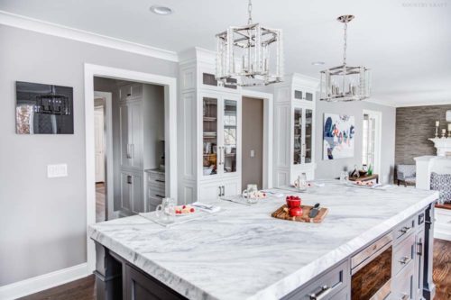 Island with white quartzite countertop in wight kitchen Towaco, NJ