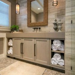 Bathroom with white oak cabinets, towels, and mirror Lake Winnipesauke, NH