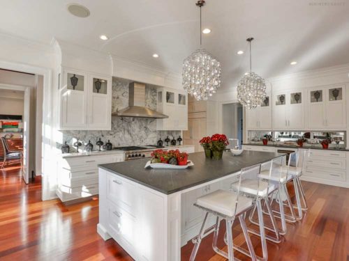 White shaker cabinets and island with four chairs New Canaan, CT