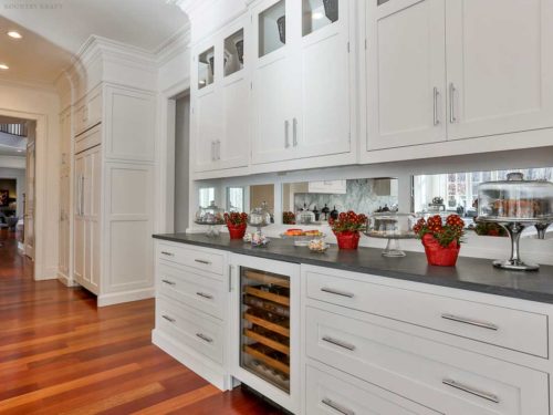 White shaker cabinets and counter with built-in wine cooler New Canaan, CT