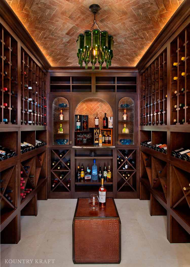 Wine room with three wine cubby walls and a wine bottle chandelier Naples, FL